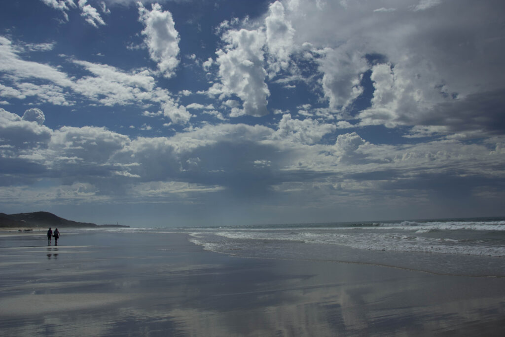 People walkung on Australian beach