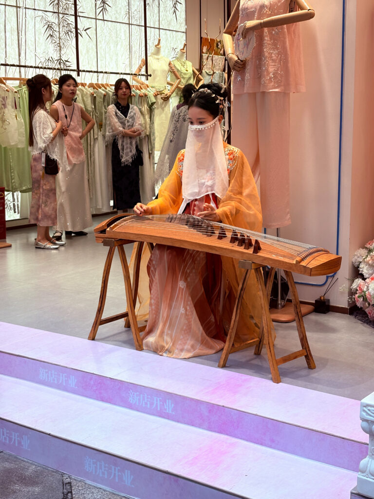 Lady playing a traditional instrument